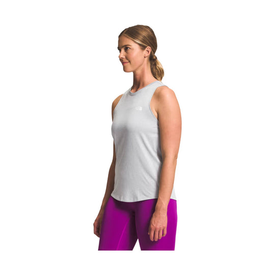 Light gray sleeveless athletic tank top on a model, shown in side view