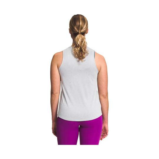 Light gray sleeveless tank top shown from the back on a model, paired with bright magenta leggings.