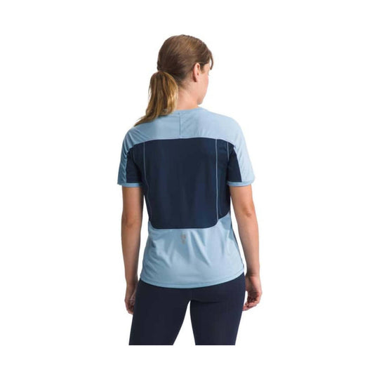 Short-sleeve athletic top in light blue and navy, shown from the back.