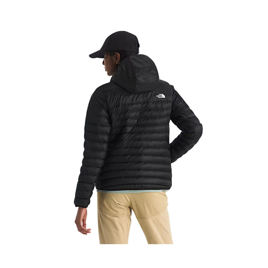 Black quilted puffer jacket shown from the back with a hood and small chest logo.