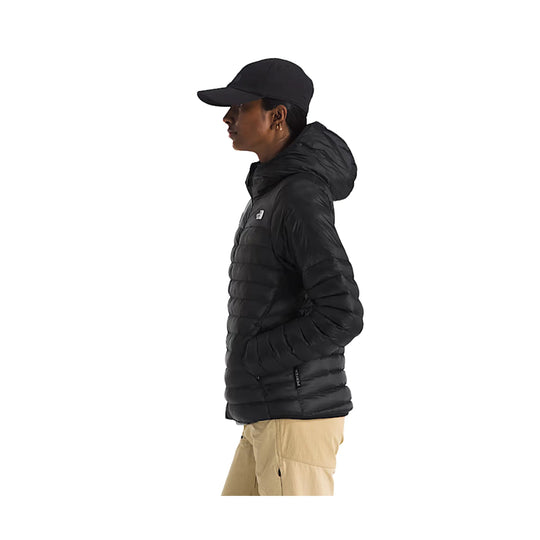 Black hooded puffer jacket shown in side profile with a small chest logo.