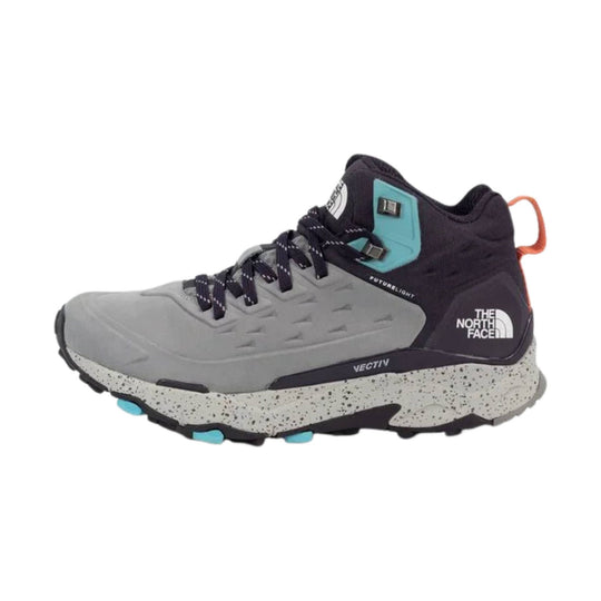 Mid-top hiking boot with gray toe, dark purple upper, teal collar accent, and speckled white sole