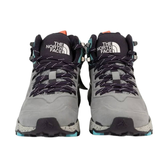 Pair of gray and dark purple hiking boots with rope laces and white logo text on the tongues