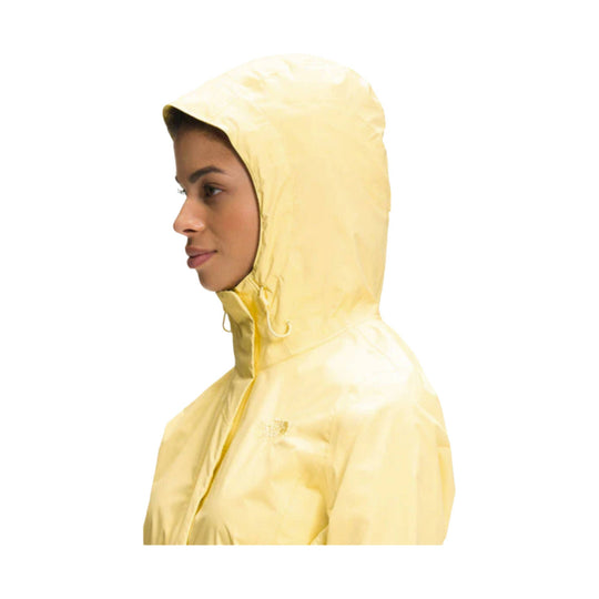 Light yellow hooded rain jacket shown in side profile