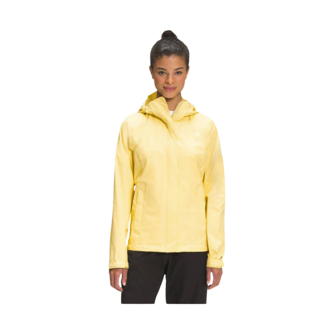 Yellow hooded rain jacket with long sleeves and half-zip front, shown with black pants.