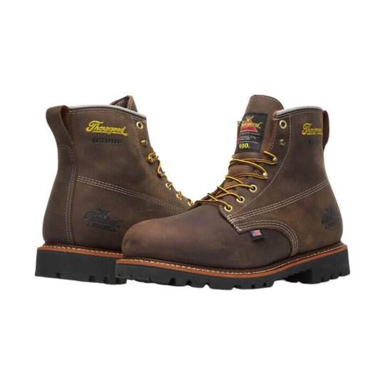 Brown lace-up work boots with yellow stitching and thick black lug soles
