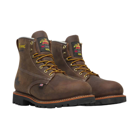 Brown lace-up work boots with black lug soles and visible ankle labels