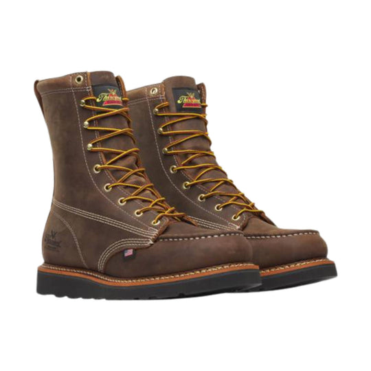 Brown leather lace-up work boots with yellow laces and black wedge soles