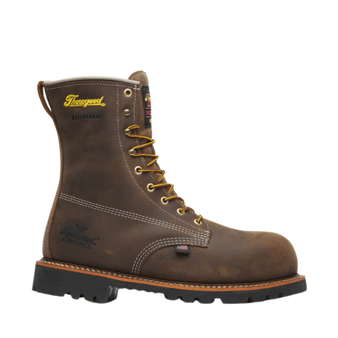 Brown leather lace-up work boot with yellow laces, black sole, and visible waterproof branding