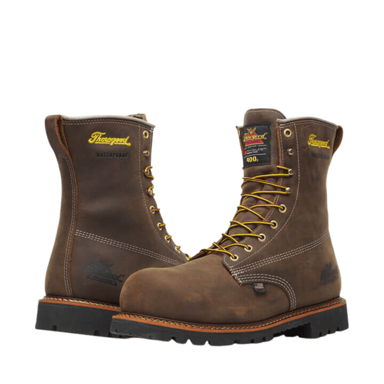 Brown lace-up waterproof work boots with yellow laces and black soles