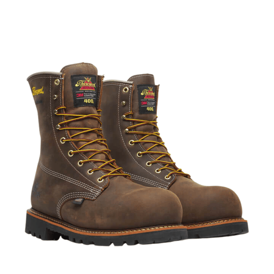 Brown insulated lace-up work boots with black lug soles and visible Thorogood and 3M Thinsulate 400 labels