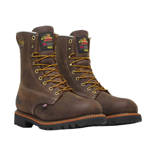 Brown leather lace-up work boots with yellow laces and black lug soles