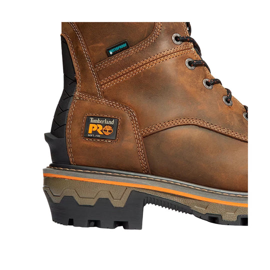 Brown leather work boot with stitched panels, metal eyelets, and rugged black lug sole