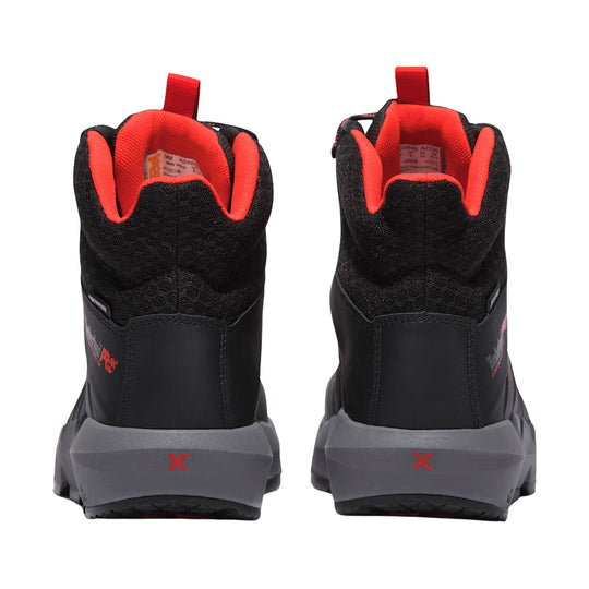 Black work boots with red interior lining and gray heel soles, rear view