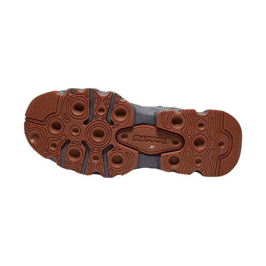 Brown rubber outsole with circular tread pattern and gray midsole