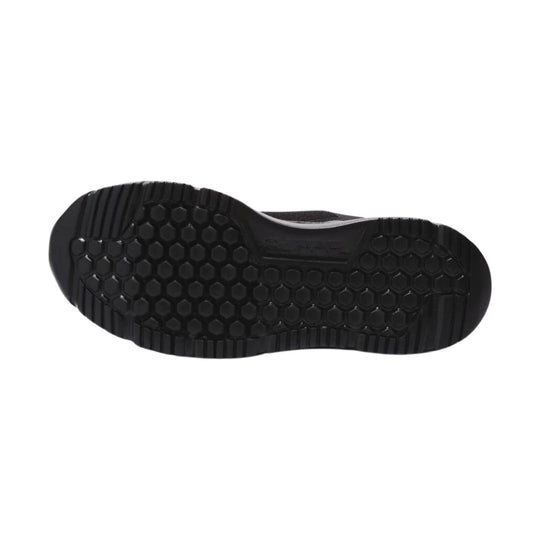 Black athletic work shoe outsole with hexagonal tread pattern and grooved edges