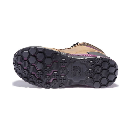 Black lugged work boot sole with hexagonal tread and purple accents, showing Timberland PRO logo.