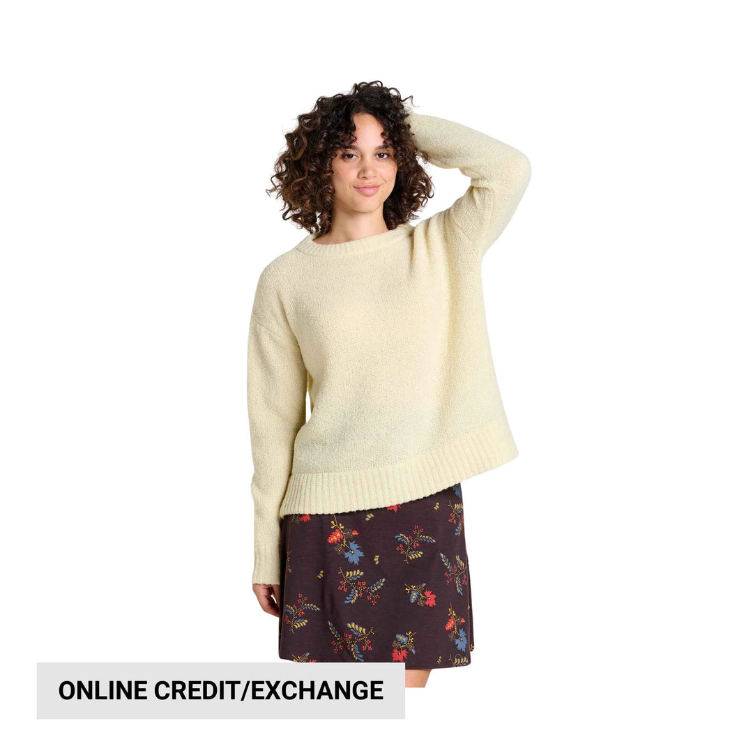 Cream oversized knit sweater with ribbed hem on a model