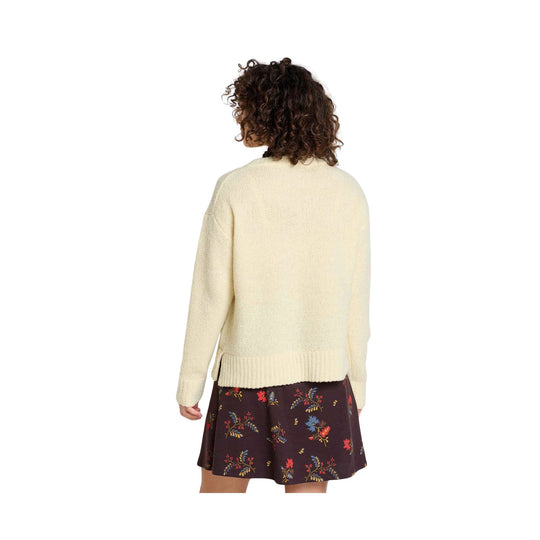 Cream knit long-sleeve sweater shown from the back with a ribbed hem