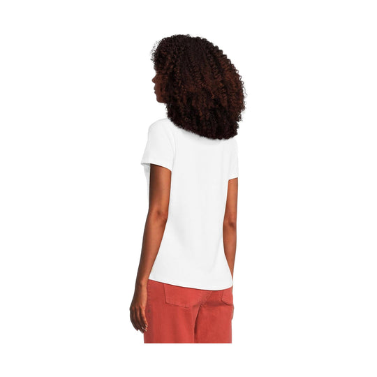 White short-sleeve T-shirt shown from the back, worn with coral pants
