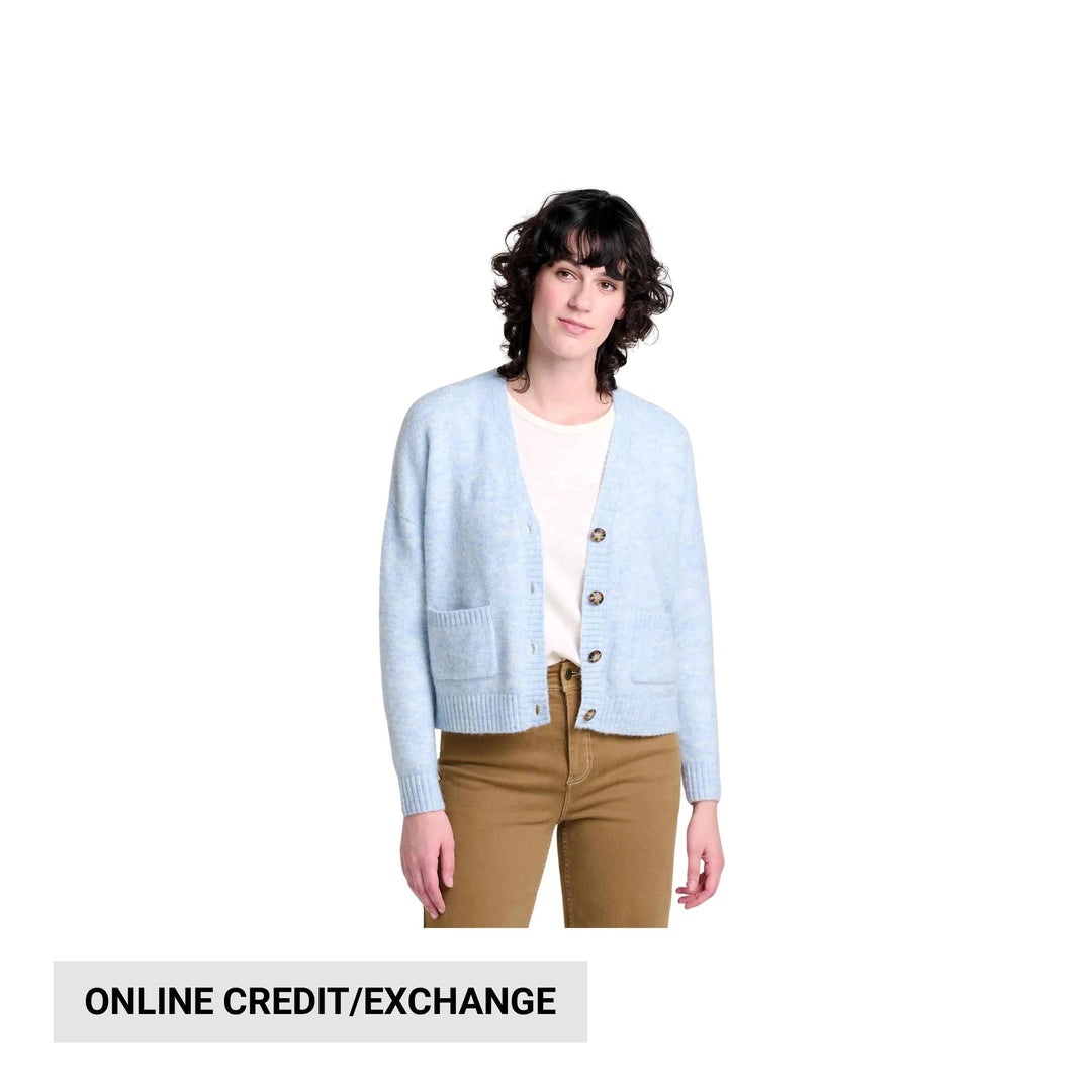 Light blue button-front cardigan over a white top with tan pants