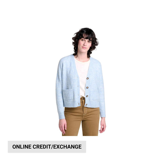 Light blue button-front cardigan over a white top with tan pants