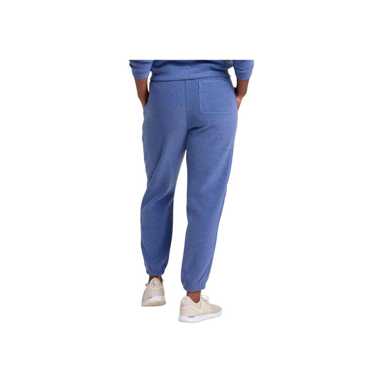 Blue terry jogger pants with elastic cuffs and back patch pocket, shown from the back