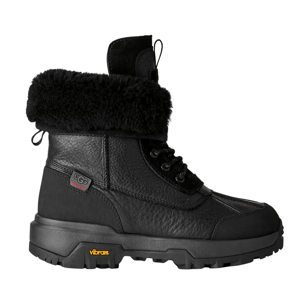Black lace-up winter boot with faux-fur cuff, pull loop, and thick lugged sole
