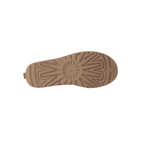 Tan boot outsole with starburst tread pattern and small logo mark