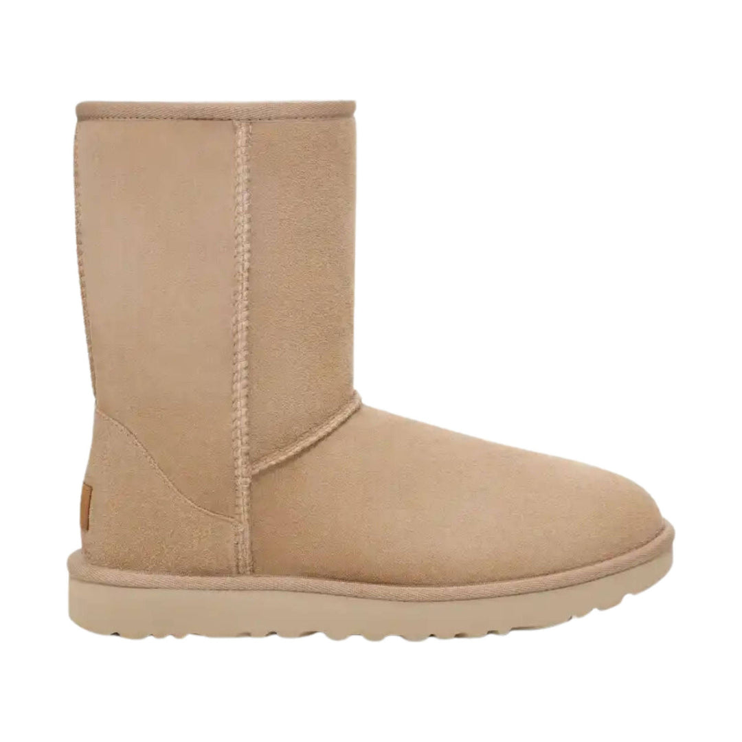 Tan suede pull-on boot with flat sole and stitched side seam