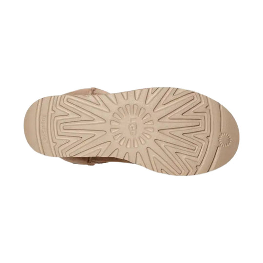 Beige boot sole with starburst tread pattern
