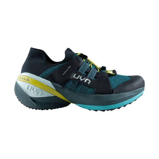 Black and teal athletic shoe with bungee laces, yellow heel accent, and visible UYN and H.A.L.O. markings