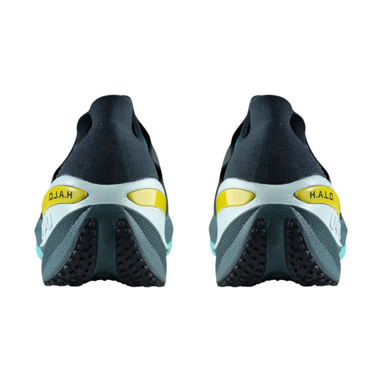 Rear view of black and gray athletic shoes with yellow heel accents and black rubber outsoles
