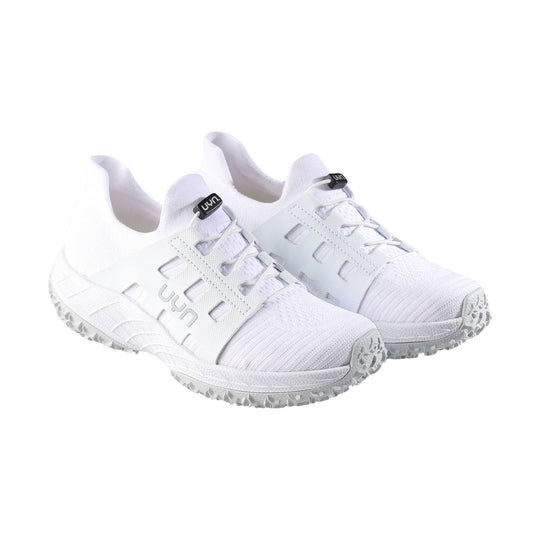 White athletic shoes with knit toe caps, side cutouts, and textured gray soles