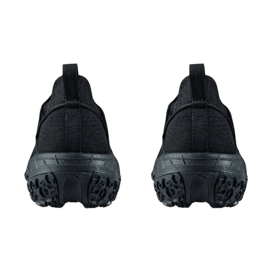 Black athletic shoes shown from the back with knit uppers, pull tabs, and rugged lug soles