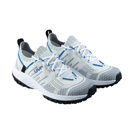 White and gray knit trail shoes with blue trim, white laces, and black lug soles