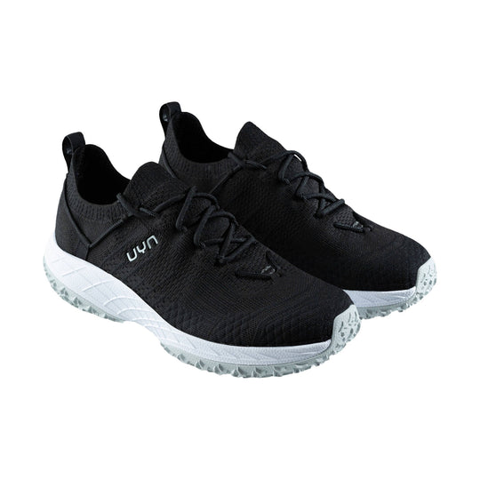 Black knit athletic shoes with white midsoles and gray lug outsoles