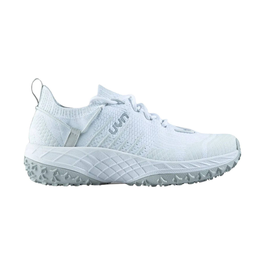 White low-top trail sneaker with knit upper, laces, and lugged sole