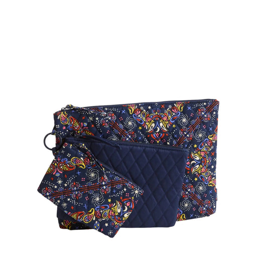 Three navy floral zip pouches, including one quilted pouch, arranged together