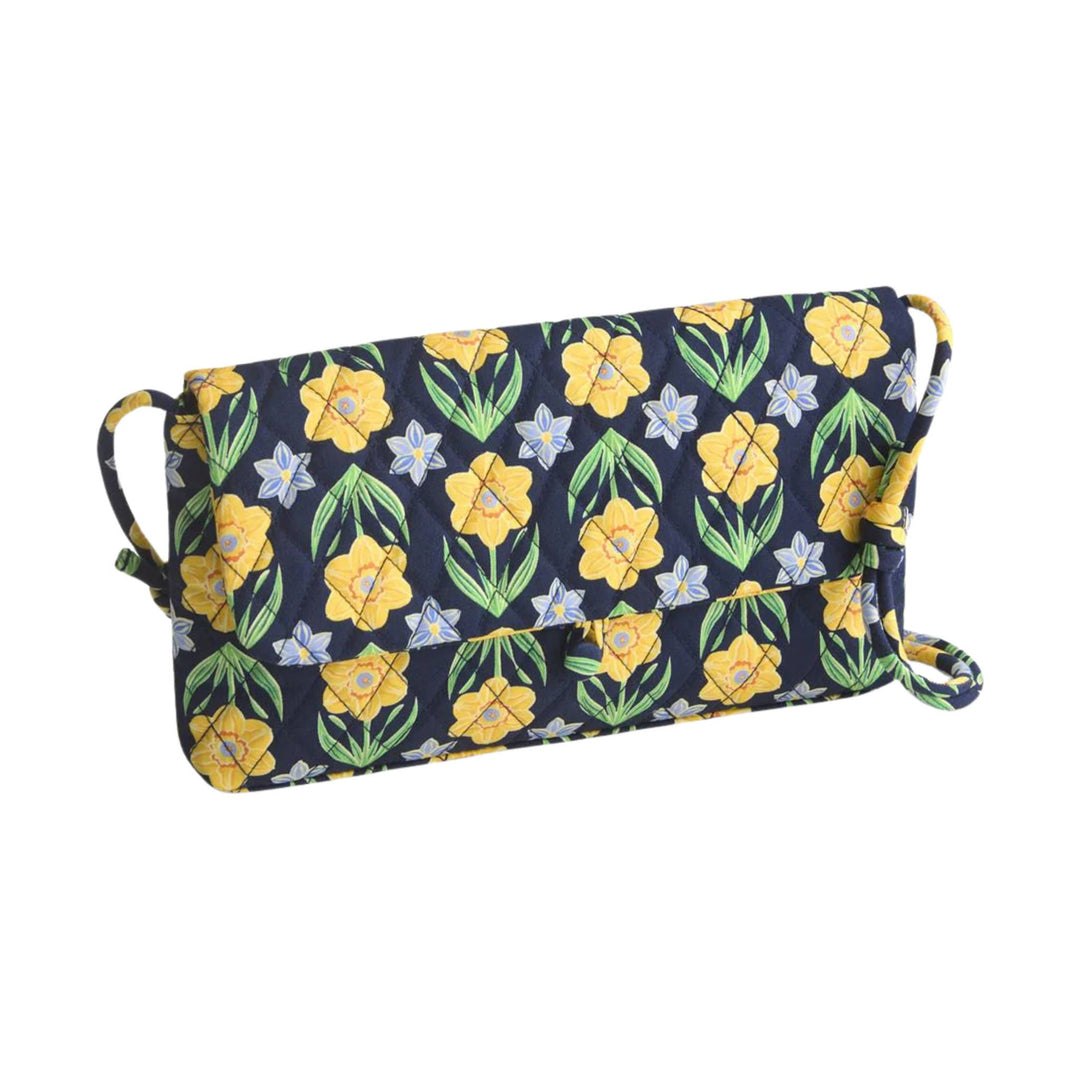 Quilted navy shoulder bag with floral print and crossbody strap
