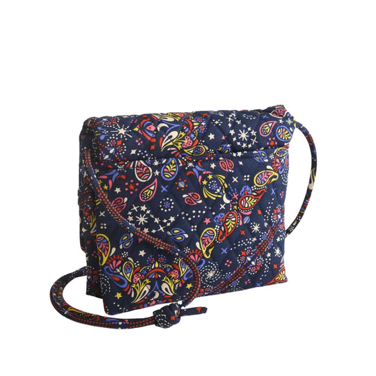 Quilted navy crossbody bag with colorful paisley and star print