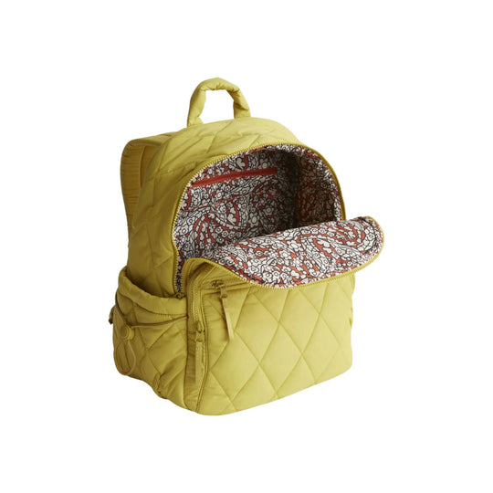 Yellow quilted backpack with front zip pocket and floral-lined open flap