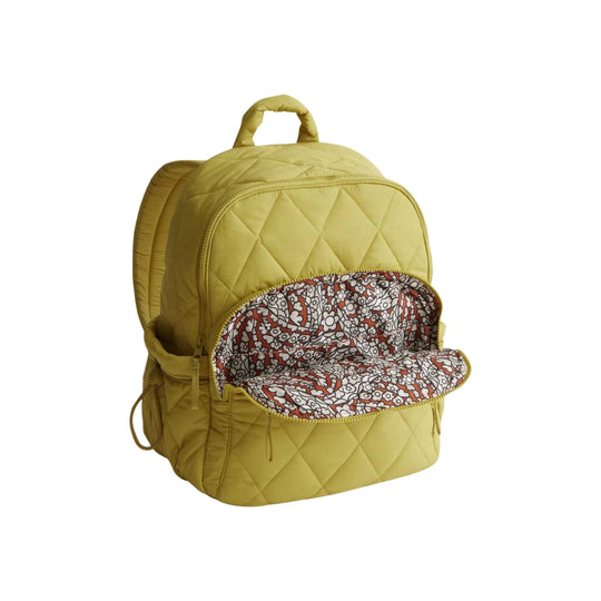 Quilted yellow backpack with front zip pocket open, showing floral patterned lining
