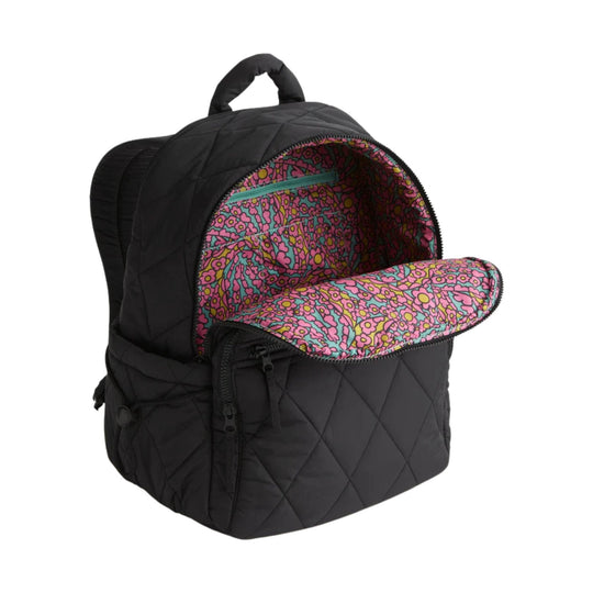 Black quilted backpack with a colorful floral lining and front zip pocket