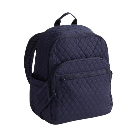 Navy quilted backpack with front zip pocket and top handle