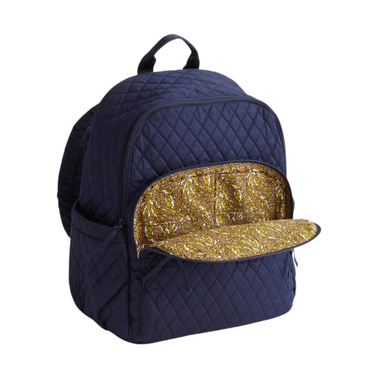 Quilted navy backpack with front zip pocket and yellow floral lining, shown open