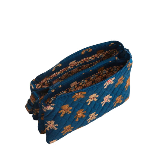 Blue quilted zip crossbody bag with teddy bear print and patterned lining