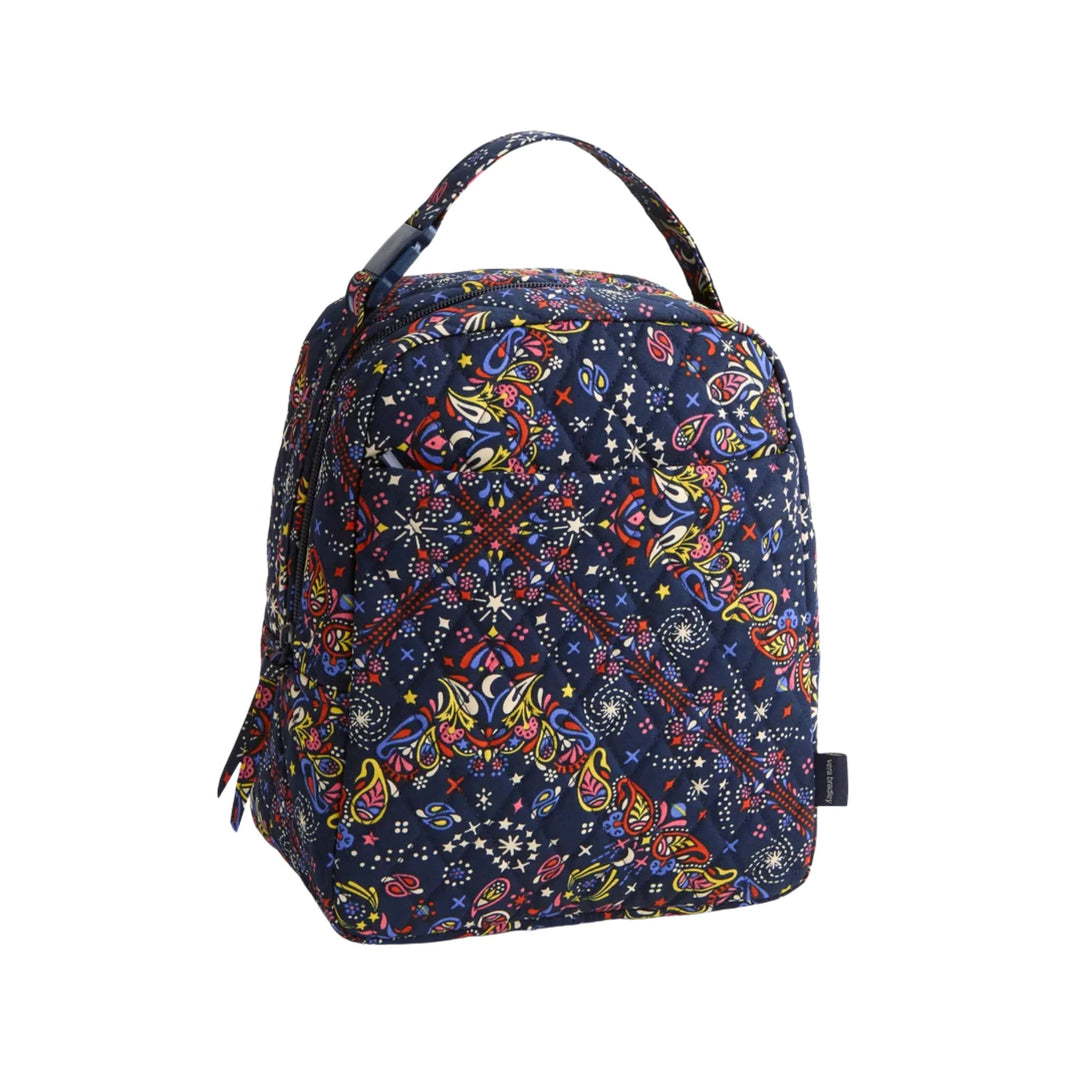 Navy quilted lunch bag with colorful paisley and star print, top handle, and zipper closure