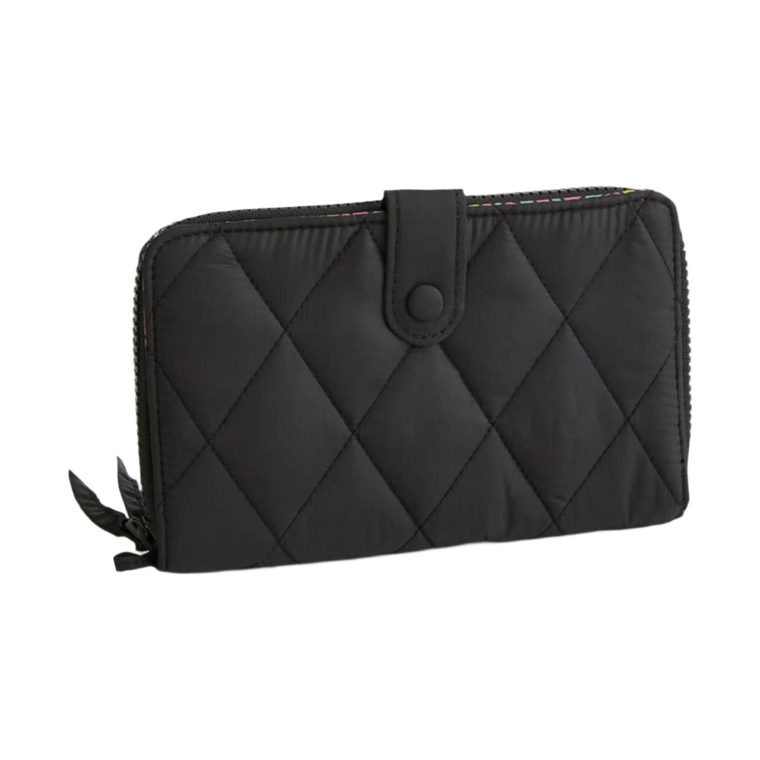 Black quilted zip wallet with snap-tab closure and side tassel pull