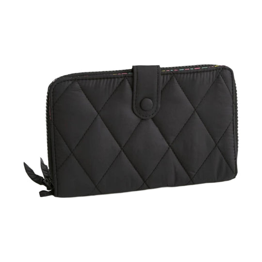 Black quilted zip wallet with snap-tab closure and side tassel pull